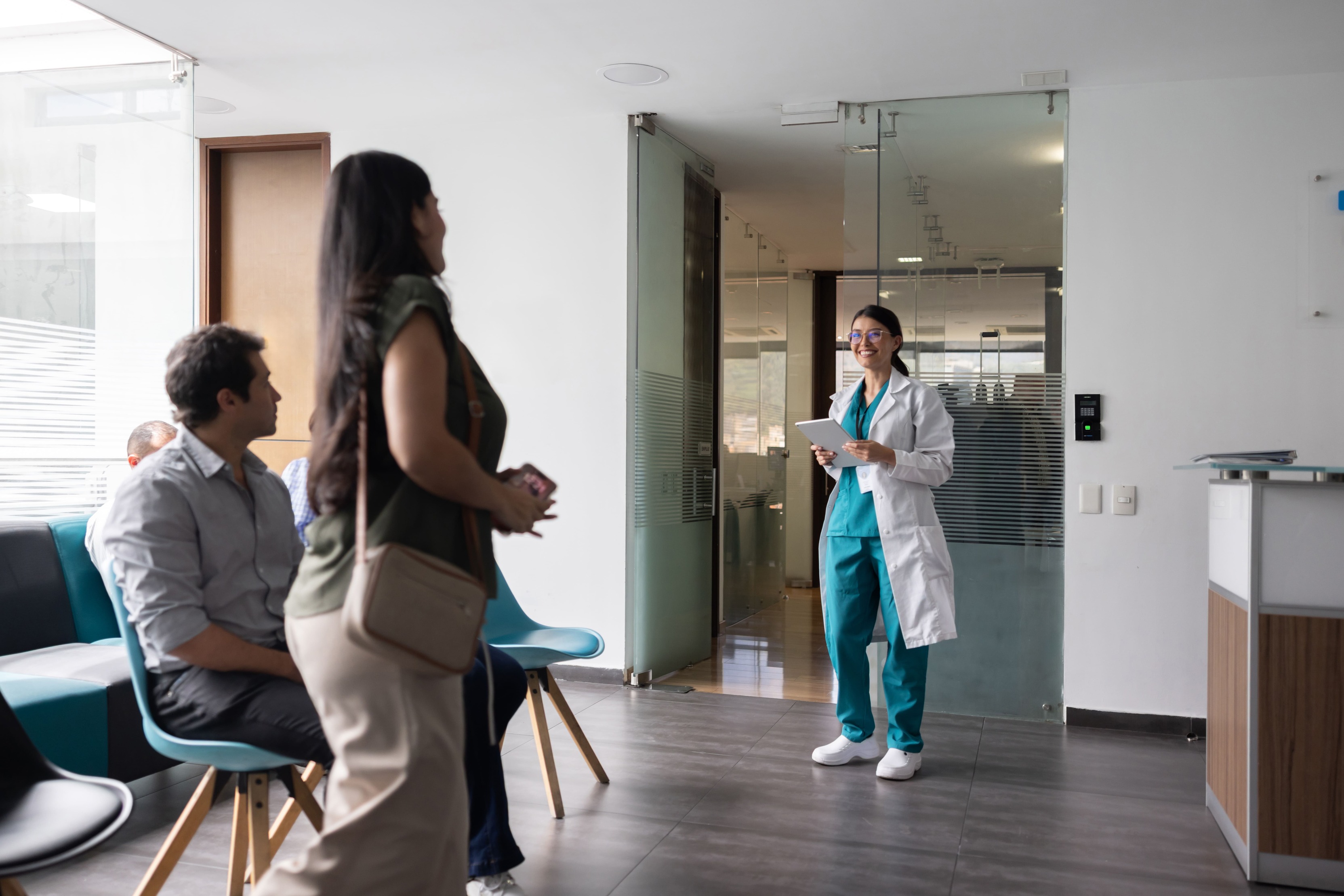 Doctor standing at clinic with patient